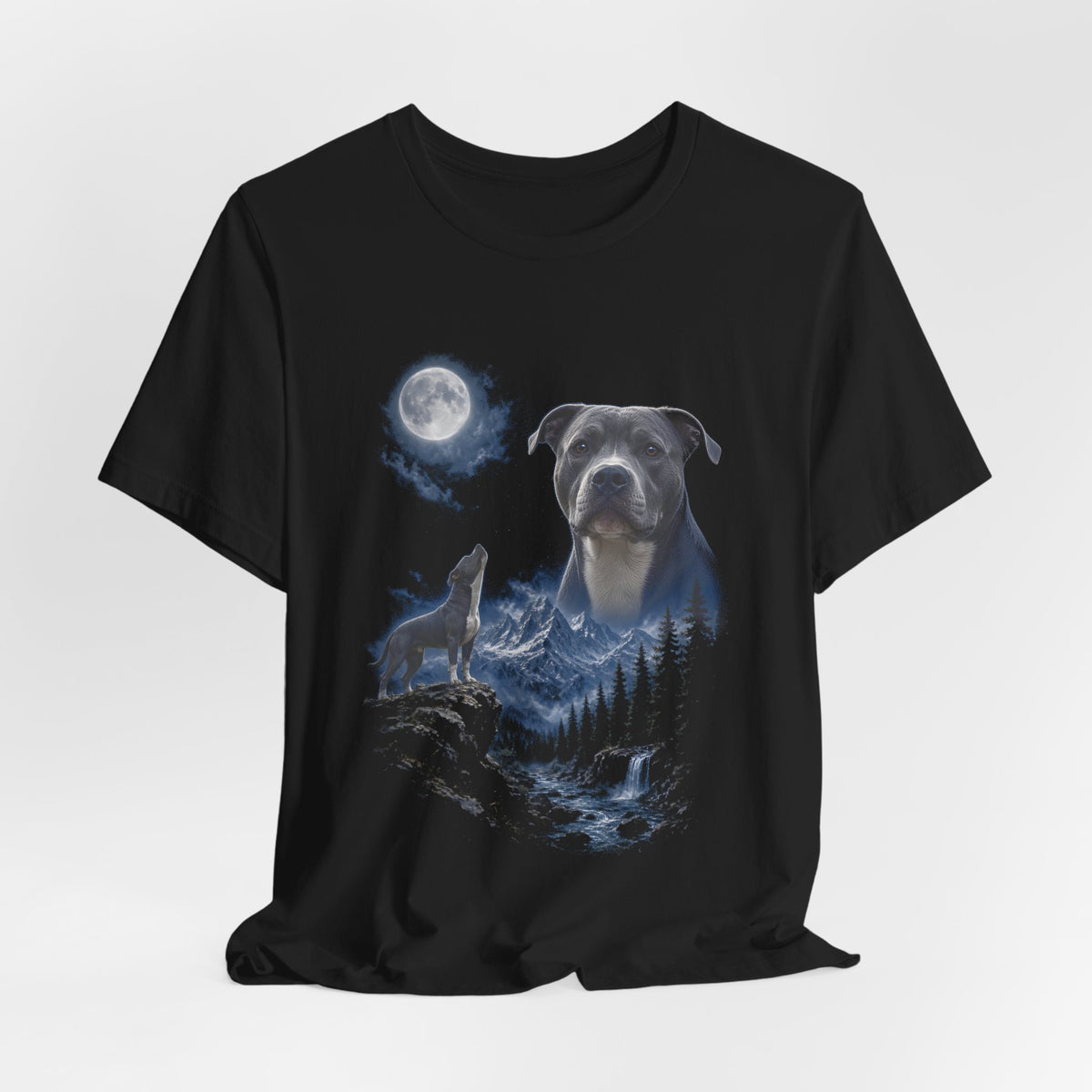 Black t-shirt with a photoreal pit bull under a full moon and a second pit bull howling on a cliff over mountains and a waterfall, flat lay
