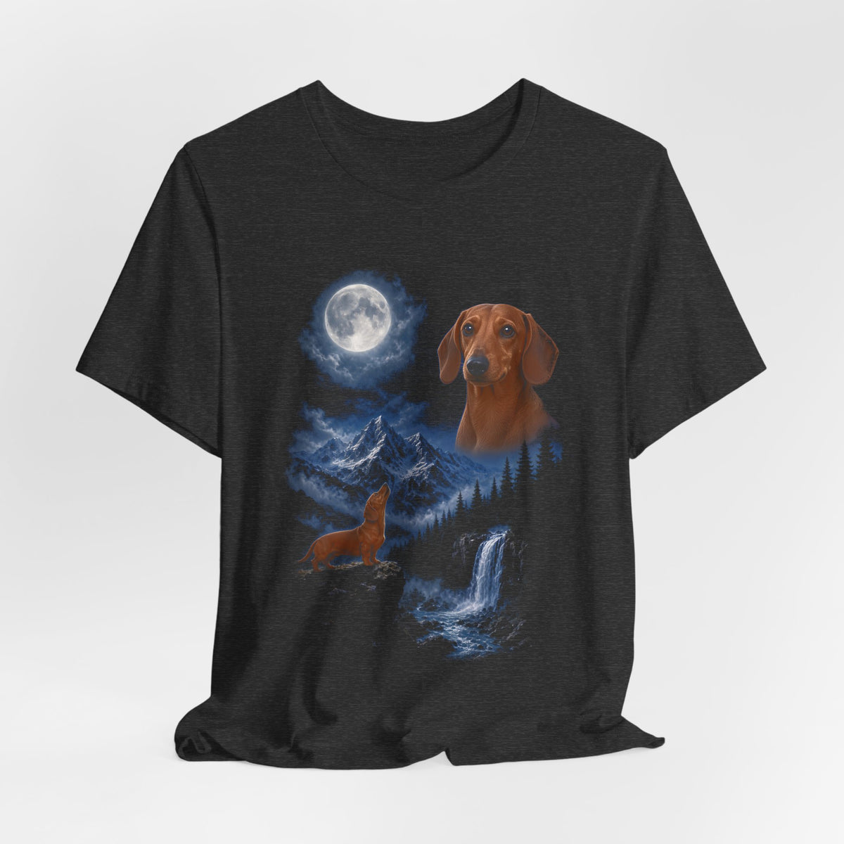 Dark Grey Heather t-shirt with a photoreal dachshund under a full moon and a second dachshund howling on a cliff over mountains and a waterfall, flat lay