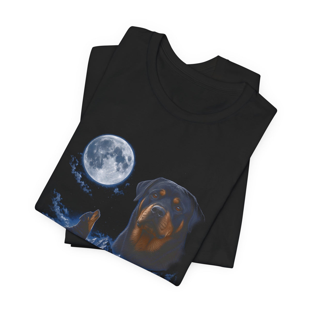 Black t-shirt with a photoreal rottweiler under a full moon and a second rottweiler howling on a cliff over mountains and a waterfall, folded