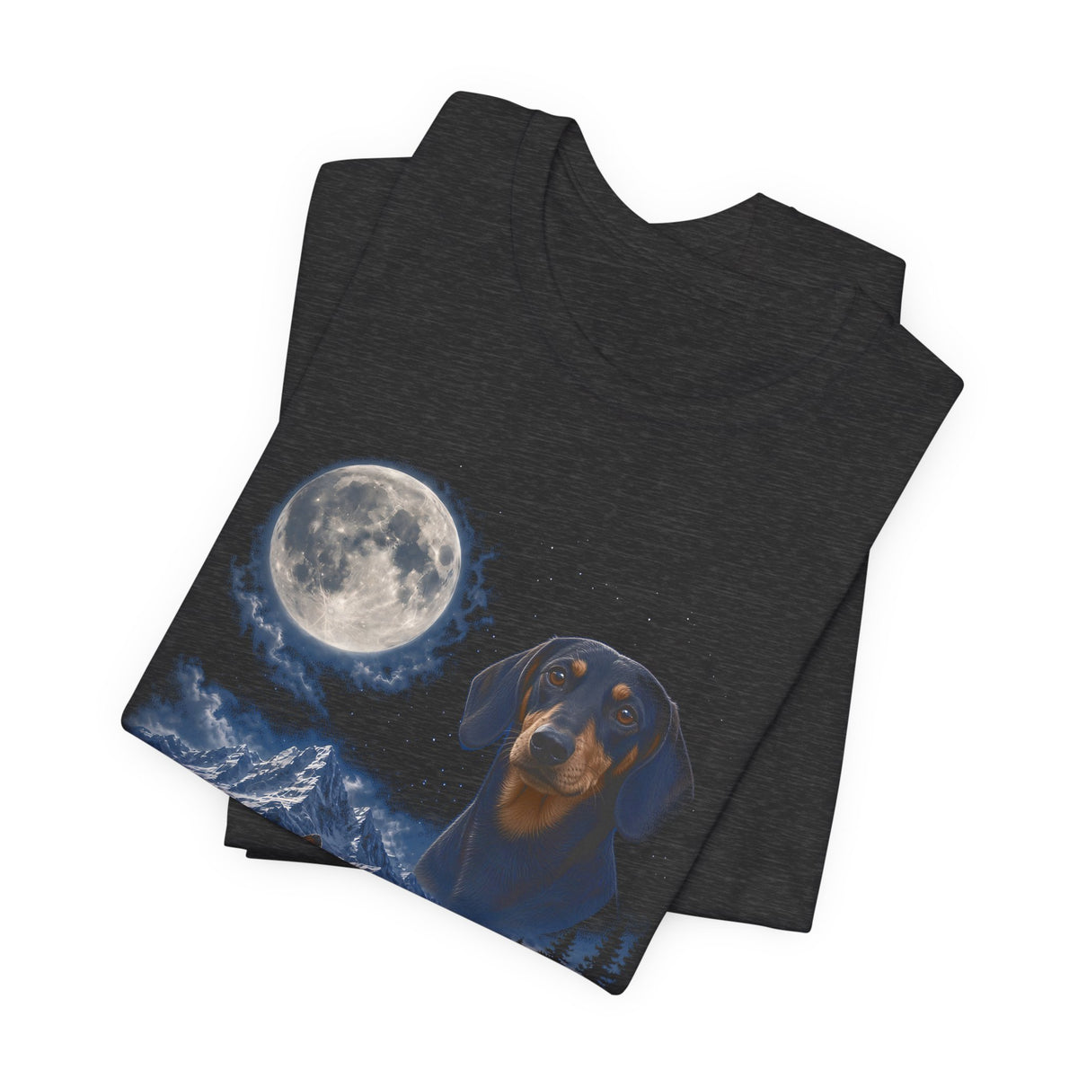 Dark Grey Heather t-shirt with a photoreal miniature dachshund under a full moon and a second miniature dachshund howling on a cliff over mountains and a waterfall, folded