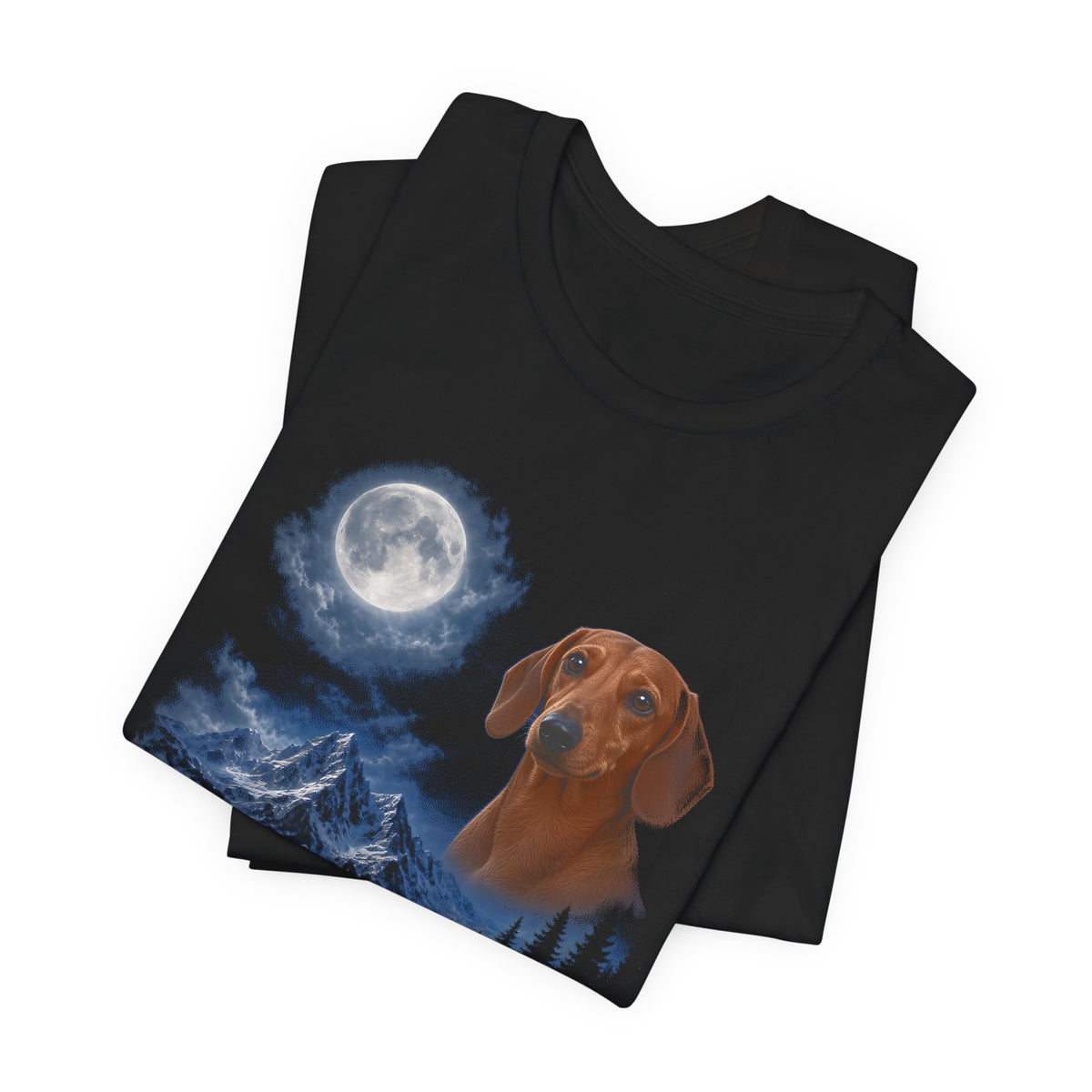 Black t-shirt with a photoreal dachshund under a full moon and a second dachshund howling on a cliff over mountains and a waterfall, folded